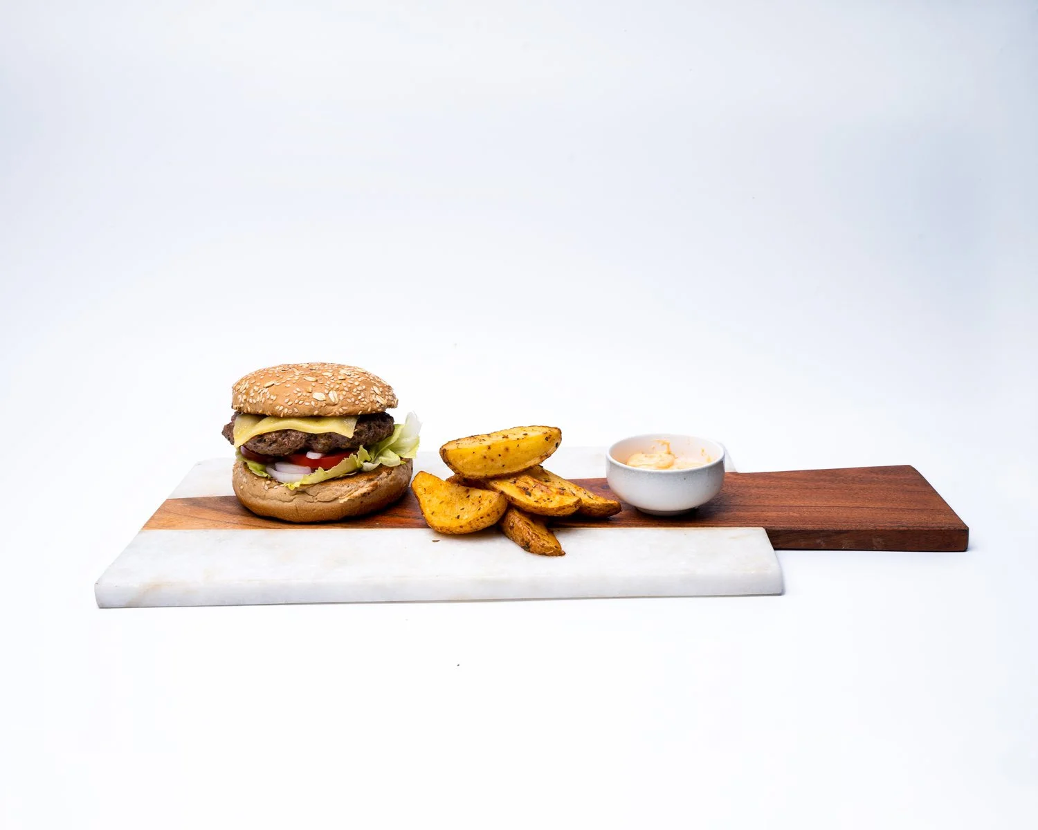 Healthy Dose Beef Burger — Lean beef patty, brioche-style bun, baked wedges.